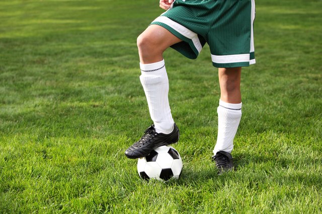 Cleets and ball on boy