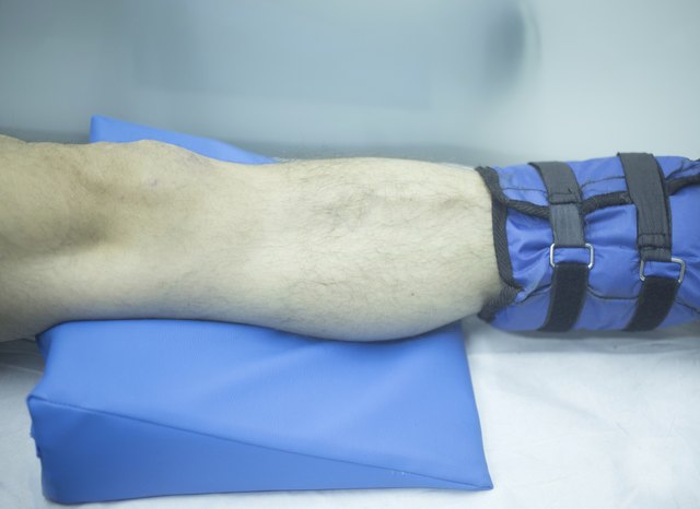 Leg of injured man in physiotherapy