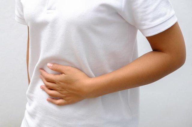 Woman Suffering From Stomach Ache