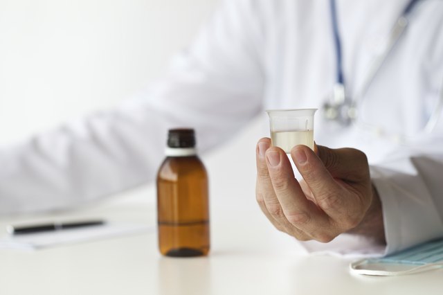 Doctor is Giving a Medicine to His Patient