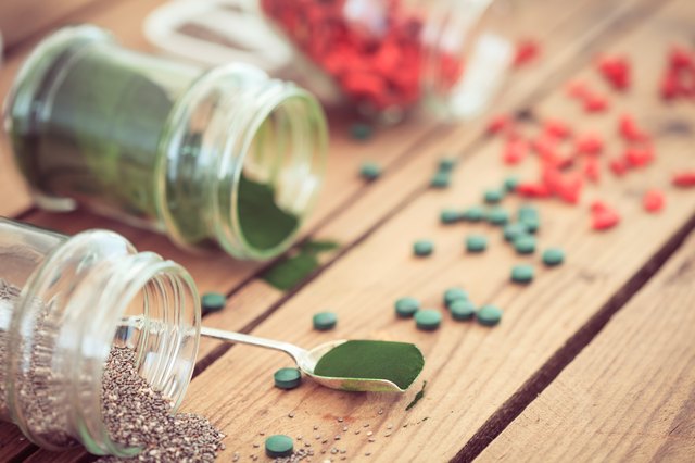 Goji, spirulina and chia seeds (superfood) on wooden tabe
