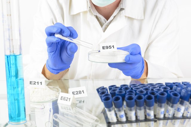 Researcher holding sweetener E951