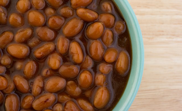 Country style baked beans in bowl close view