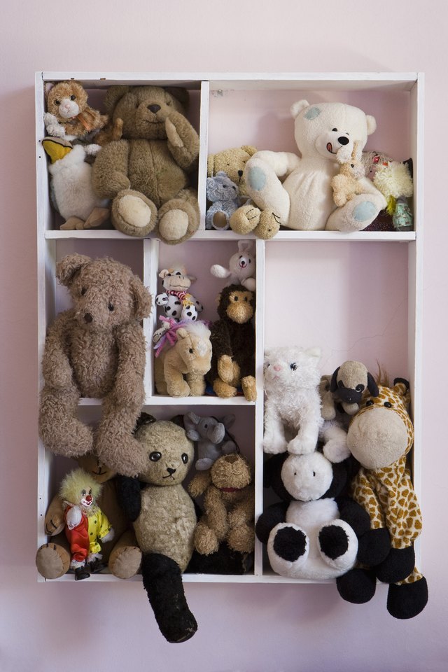 Stuffed animals on shelves