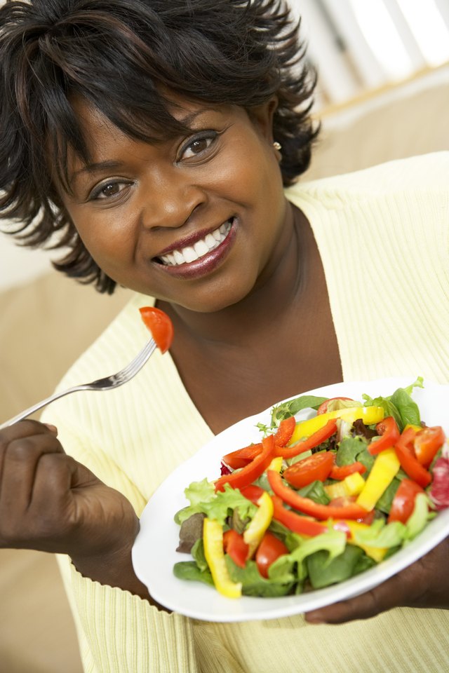 Woman eating salad