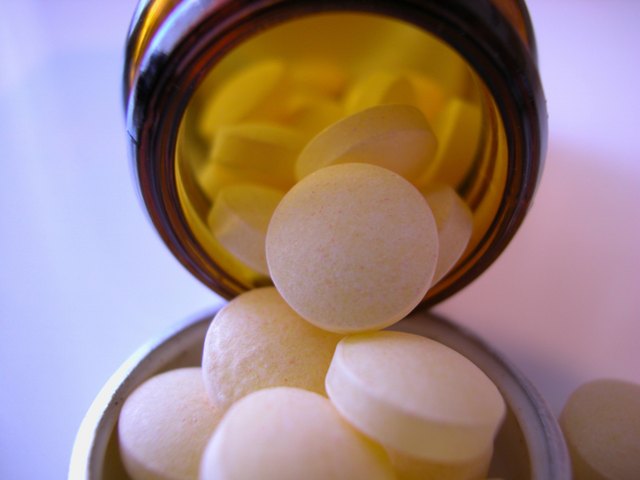 Pills spilling from bottle