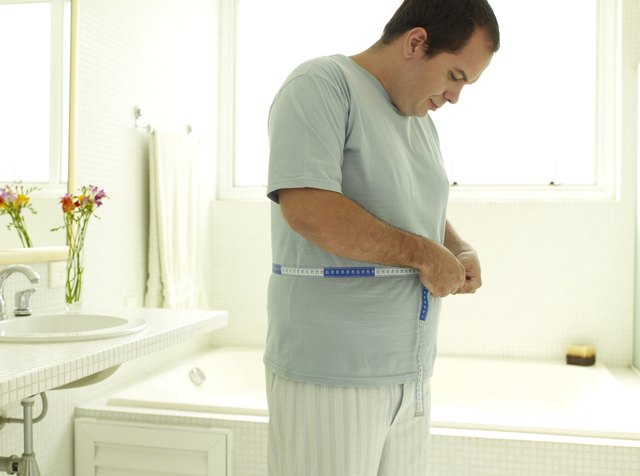 Man measuring his waist