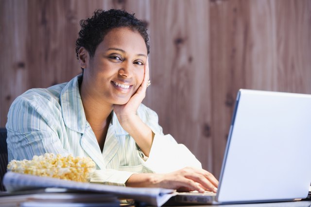 African businesswoman working in pajamas