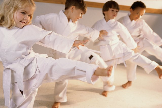 Group of children learning karate