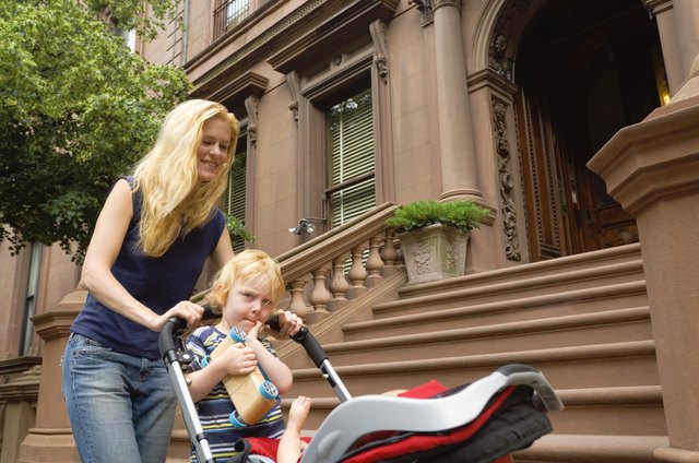 Mother and son pushing stroller