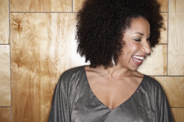 Woman laughing, looking away