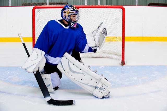 Ice hockey goalie in rink