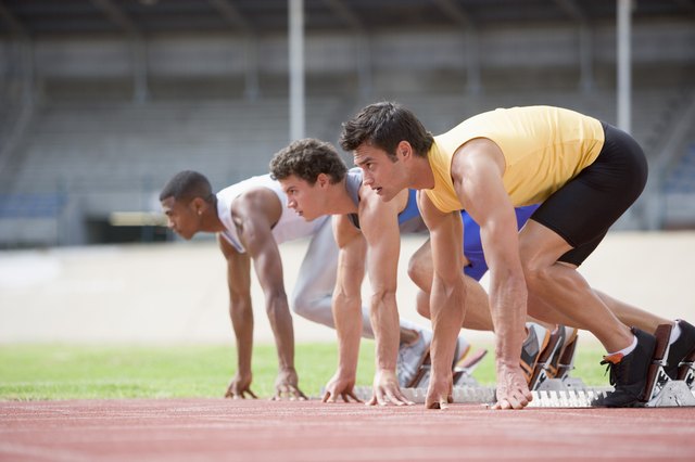 Athletes crouching at starting line
