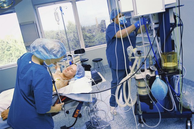 Two female nurses preparing for an operation in an operating room