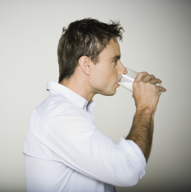 Profile of man drinking milk