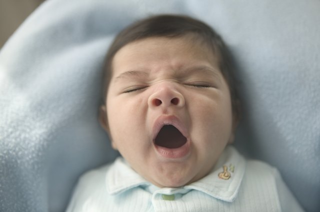 High angle view of a baby yawning