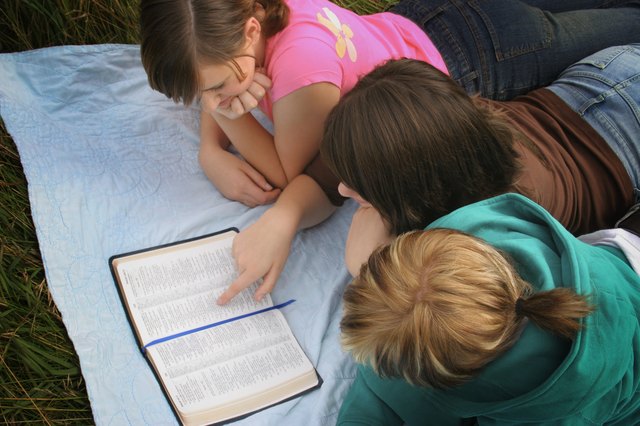 Teenagers studying the bible