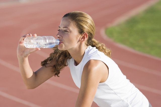 Runner drinking water
