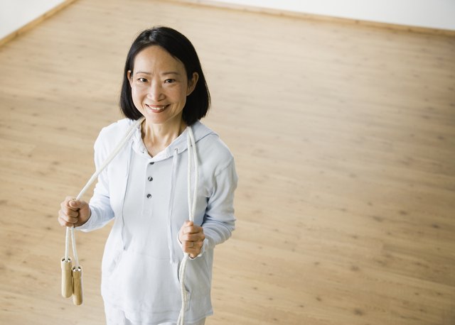 Asian woman holding jump rope