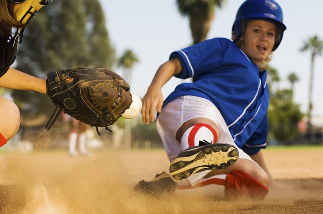 Runner Sliding Home as Catcher Grabs Softball