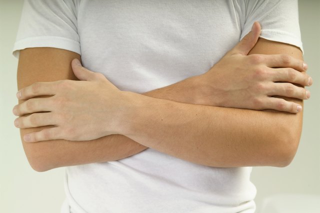 Person with arms crossed, close-up, midsection, part of