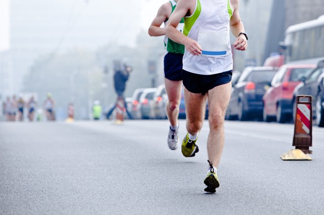 People running in city marathon
