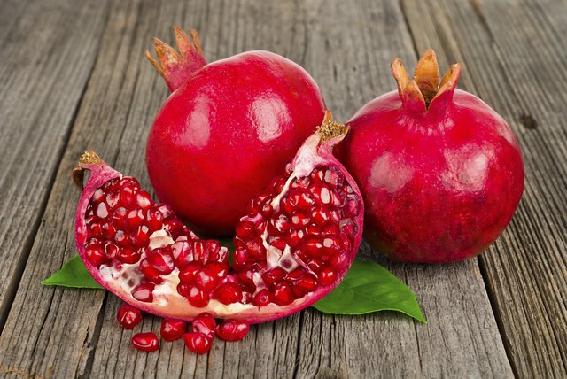 Fresh ripe pomegranates with leave