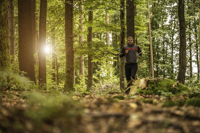 Man running in forest