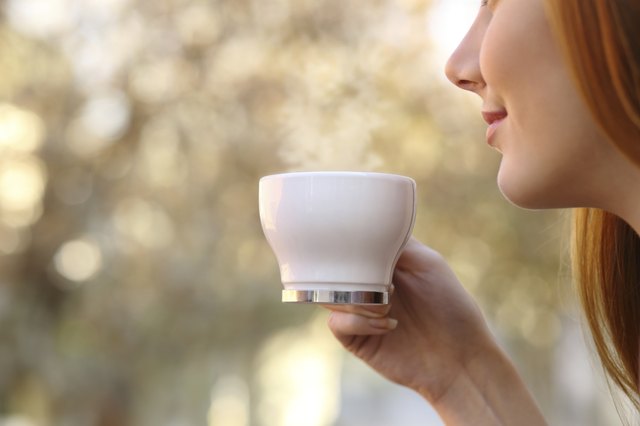 Woman holding a coffee cup
