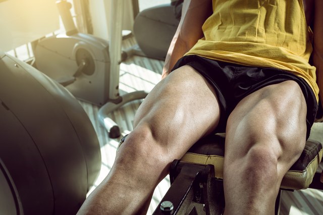 Man doing leg extension in gym