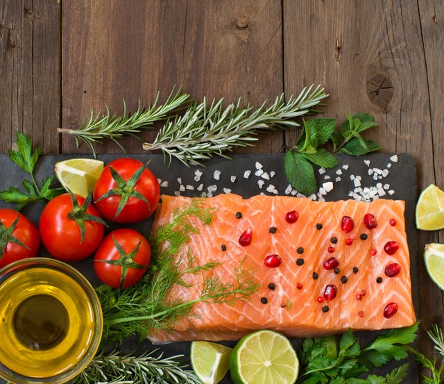 Salmon with vegetables, olive oil and herbs