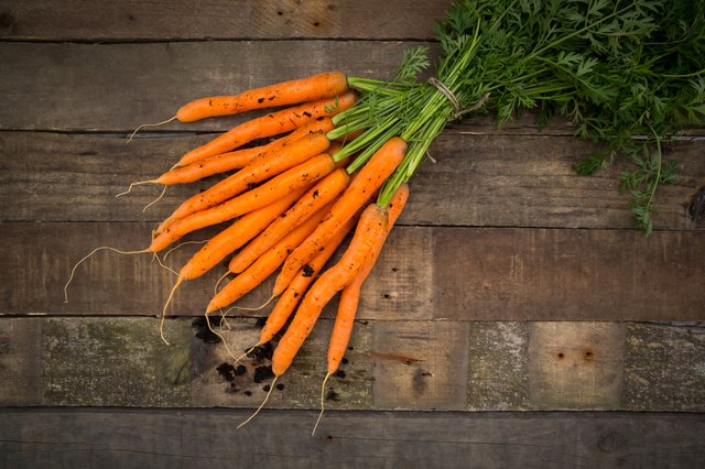 Bunch of carrots on wood