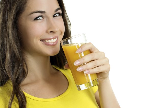 Beautiful woman drinking orange juice