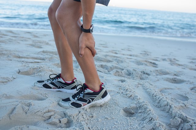 Fit man having muscle pain