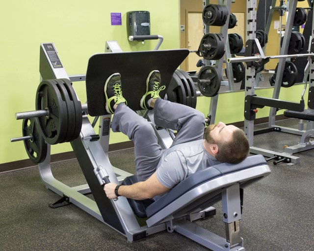 Man Using Plate Loaded Leg Press