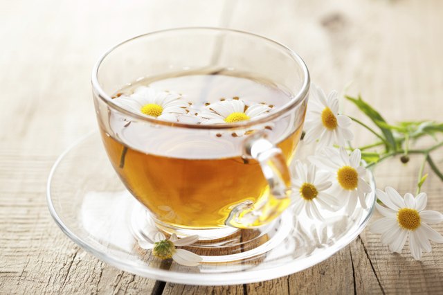 cup of herbal tea with chamomile flowers