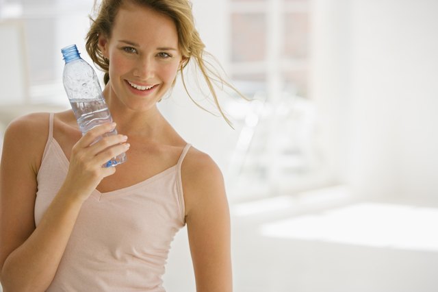 Woman holding bottled water