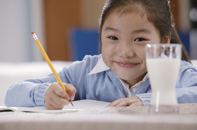Portrait of girl doing homework
