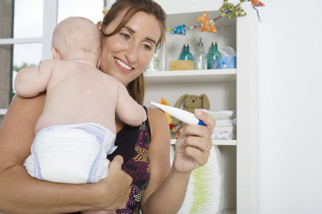Mother checking temperature of baby