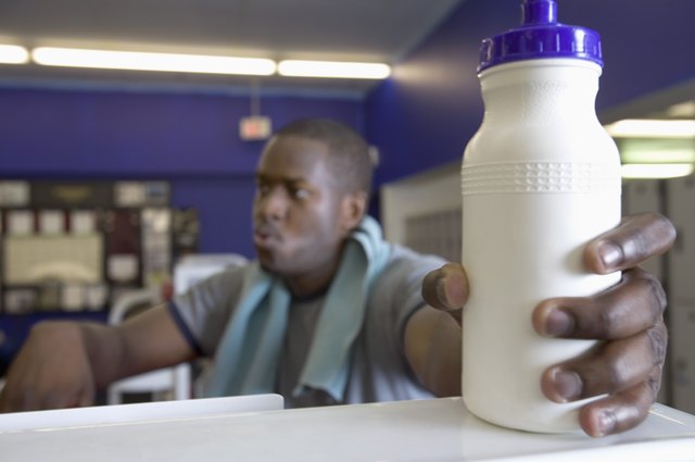 Man reaching for sports bottle