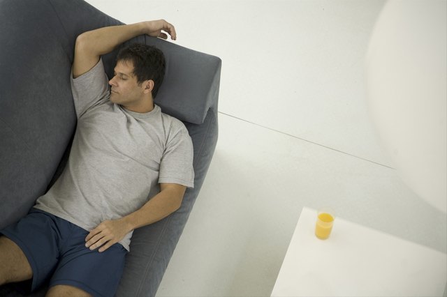 Mature man sleeping on couch
