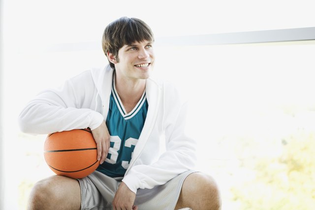 Seated basketball player looking away