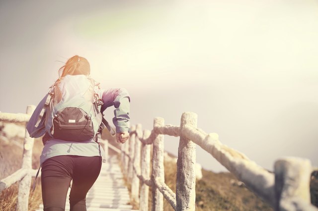 woman running on mountain stairs