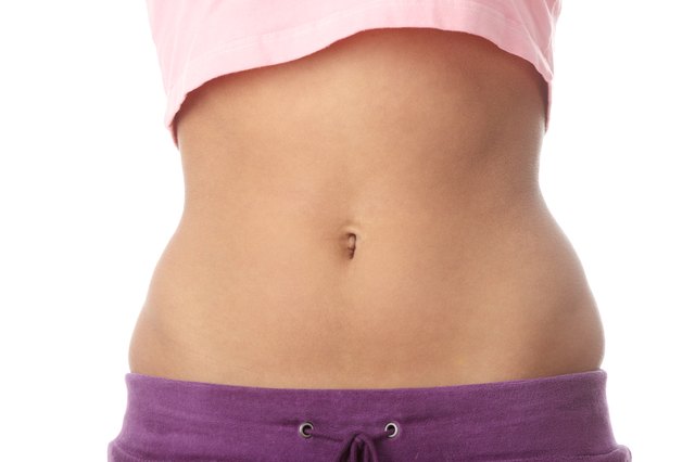 Belly of beautiful young female sportsman