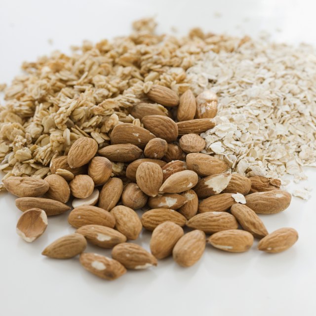 Close up of almonds, granola and oats