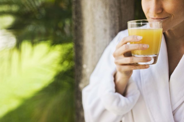 Woman drinking orange juice