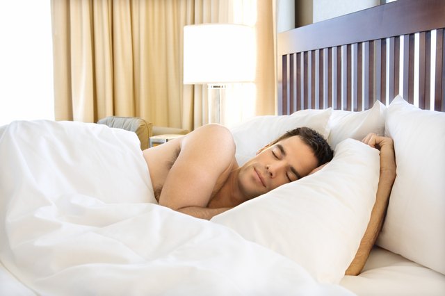 Man sleeping in hotel room