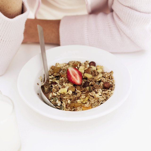 Woman in front of a bowl of breakfast cereal