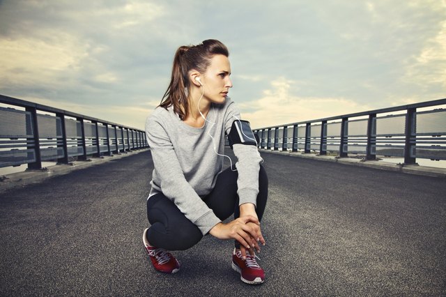 Fitness Runner on the Bridge Resting