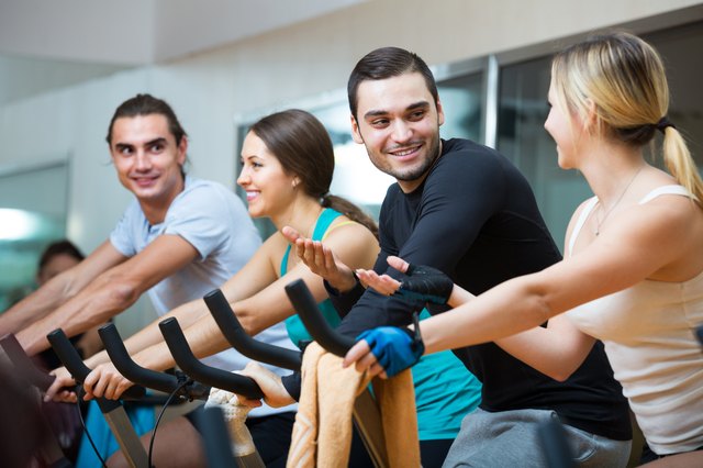 People training on exercise bikes